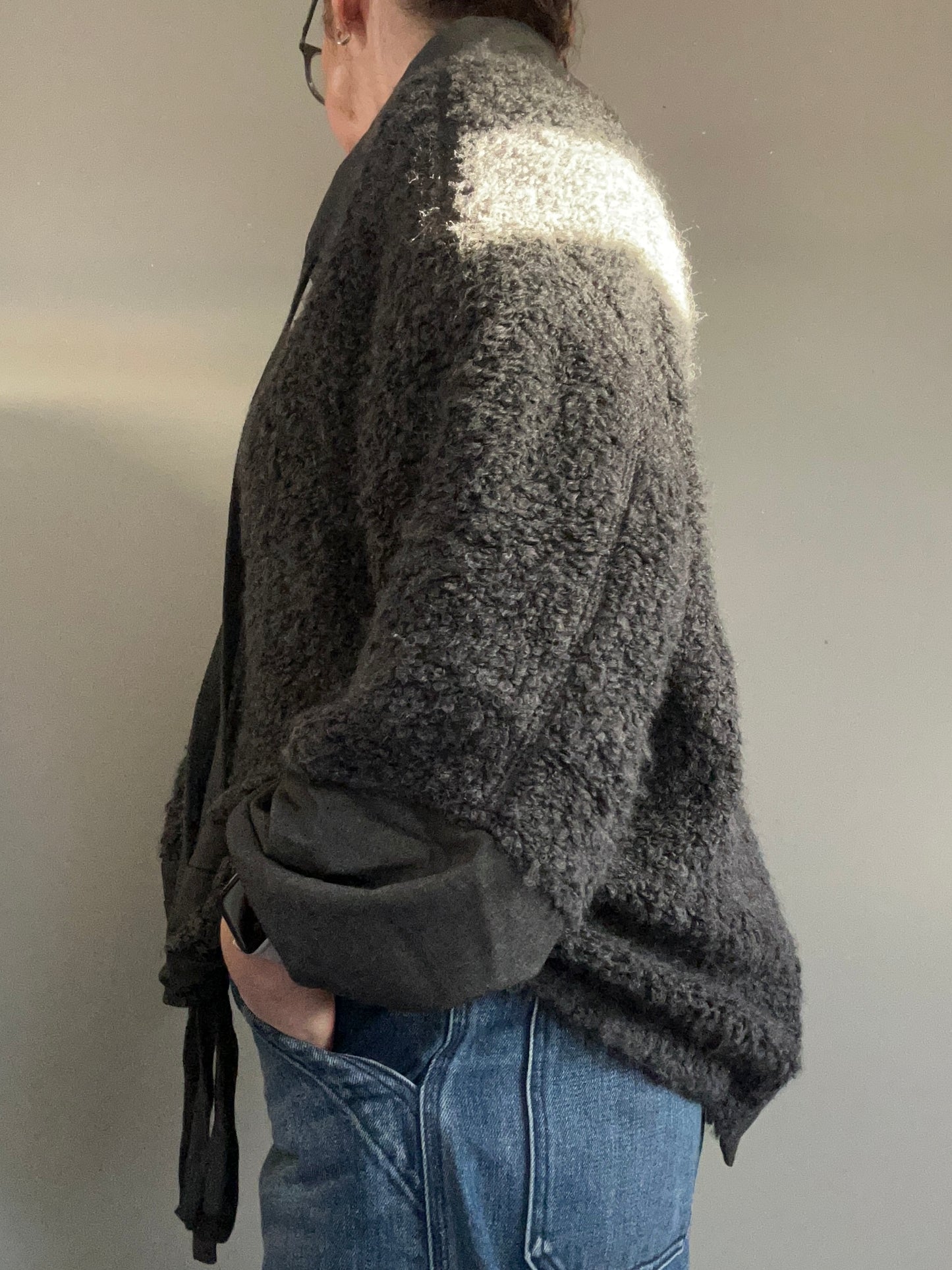 NU Black fuzzy jumper with funnel neck size 10-14